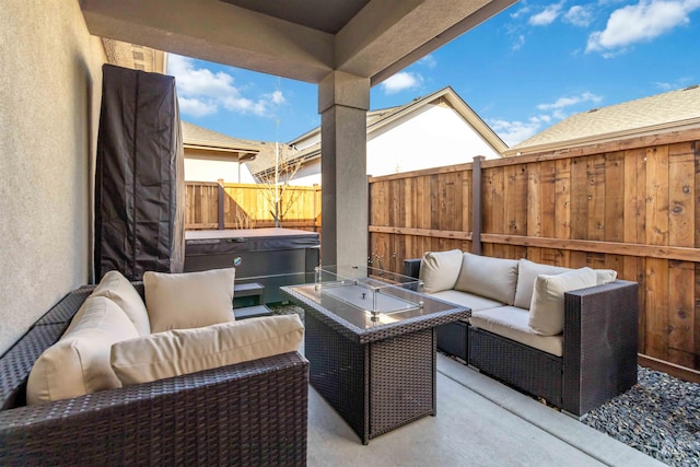 view of patio / terrace featuring an outdoor hangout area and a hot tub