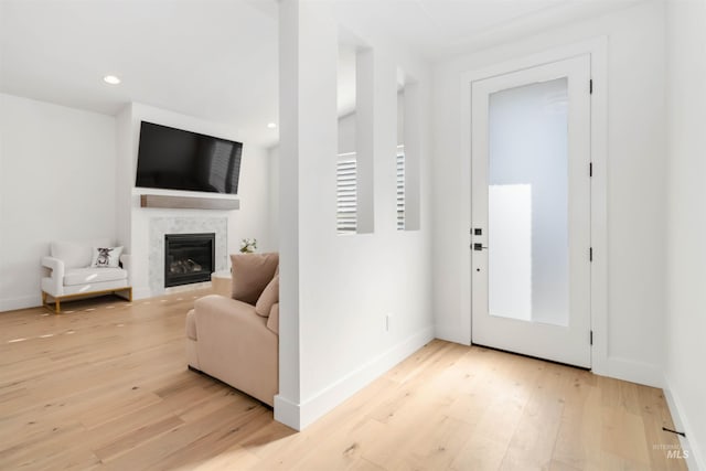 entryway with light hardwood / wood-style flooring