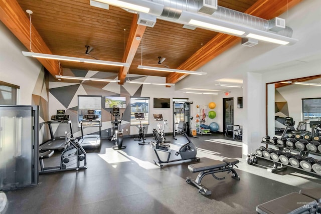 exercise room with wood ceiling