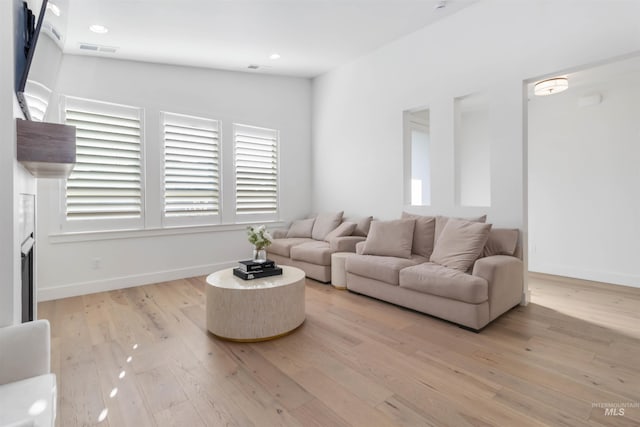 living room with light hardwood / wood-style floors