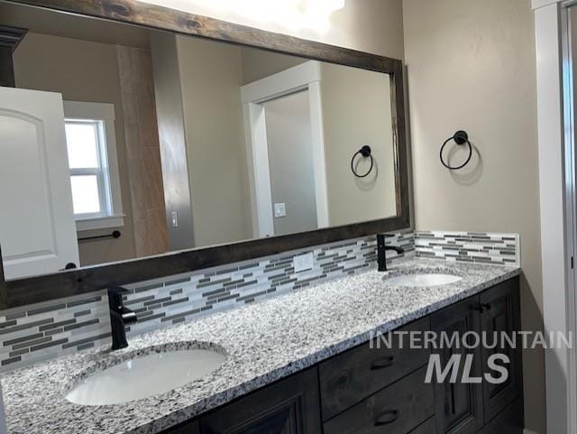 bathroom with backsplash and vanity