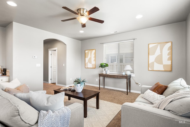 11661 W Baserri, Boise, ID 83709 - living area with arched walkways, ceiling fan, light carpet, recessed lighting, and baseboards