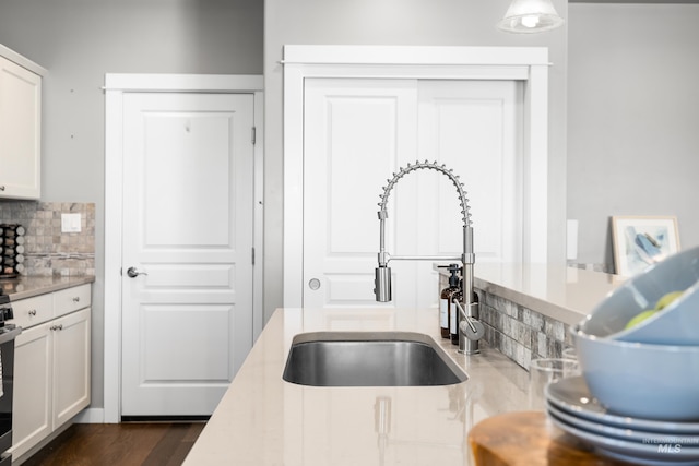 11661 W Baserri, Boise, ID 83709 - kitchen with a sink, tasteful backsplash, and light countertops