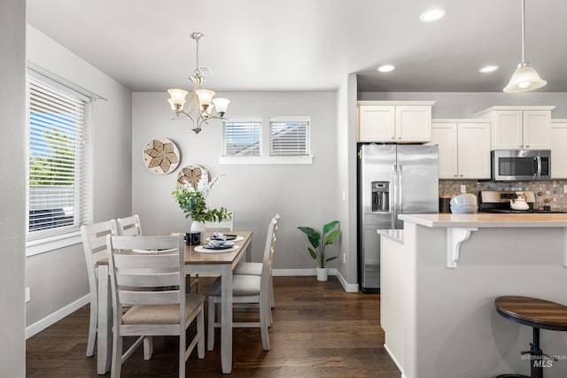 11661 W Baserri, Boise, ID 83709 - dining area featuring baseboards, dark wood-type flooring, recessed lighting, and a chandelier