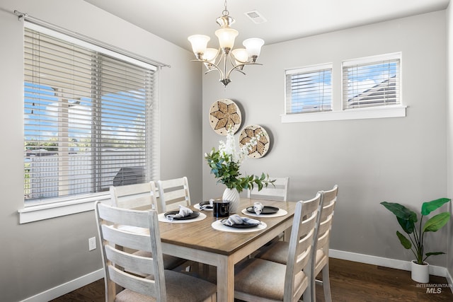 11661 W Baserri, Boise, ID 83709 - dining space featuring a chandelier, plenty of natural light, baseboards, and dark wood-style floors
