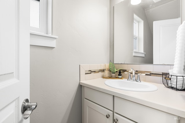 11661 W Baserri, Boise, ID 83709 - bathroom featuring vanity and backsplash