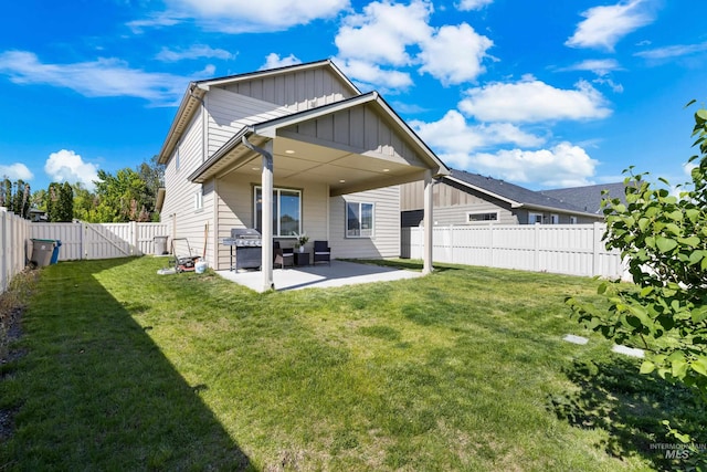 11661 W Baserri, Boise, ID 83709 - rear view of property with board and batten siding, a patio, and a gate