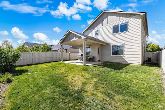 11661 W Baserri, Boise, ID 83709 - back of property with board and batten siding, a patio area, and central AC unit