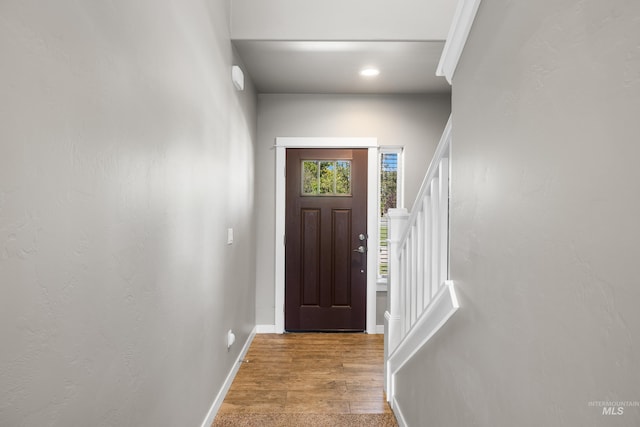 11661 W Baserri, Boise, ID 83709 - foyer with wood finished floors, stairs, baseboards, and recessed lighting