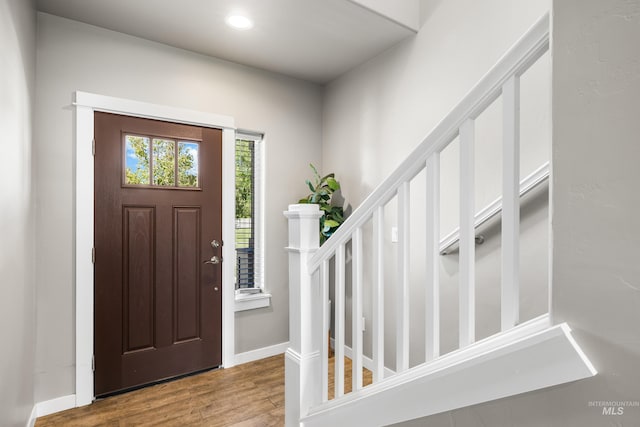 11661 W Baserri, Boise, ID 83709 - foyer with wood finished floors, baseboards, recessed lighting, and stairs