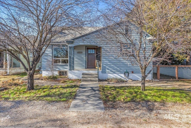 view of front of home featuring fence