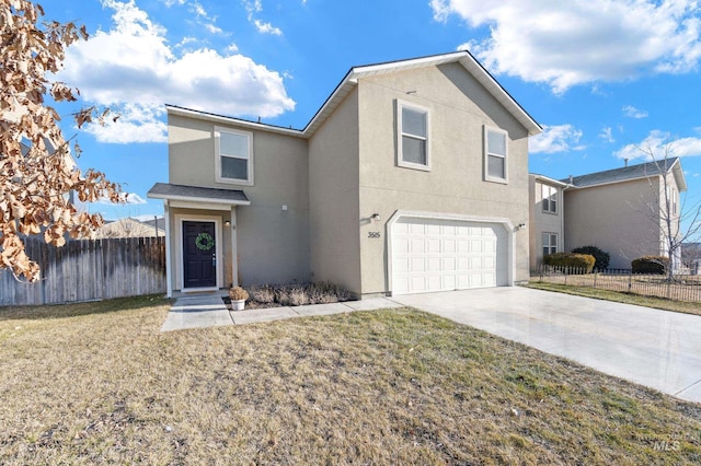 view of property featuring a garage and a front yard