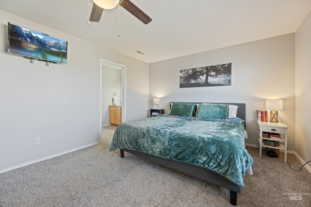 bedroom featuring connected bathroom, ceiling fan, and carpet