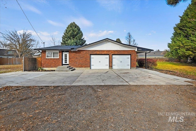 ranch-style home featuring a garage