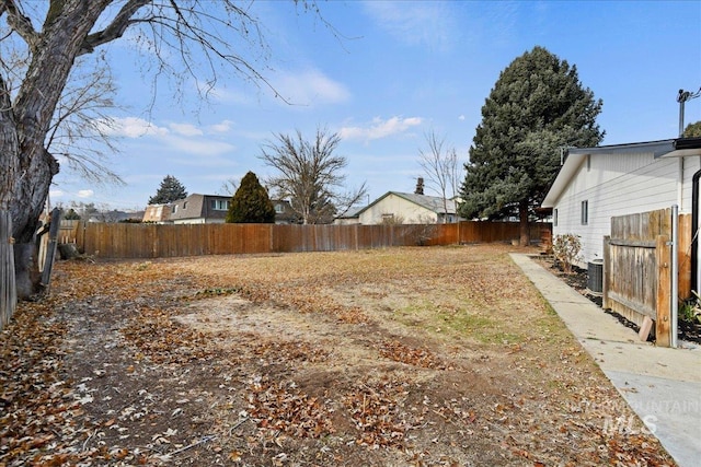 view of yard featuring central AC unit