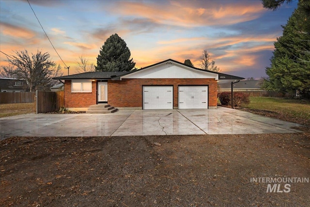 single story home featuring a garage