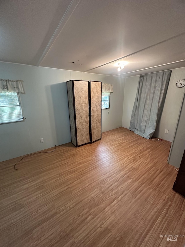 unfurnished bedroom with wood finished floors