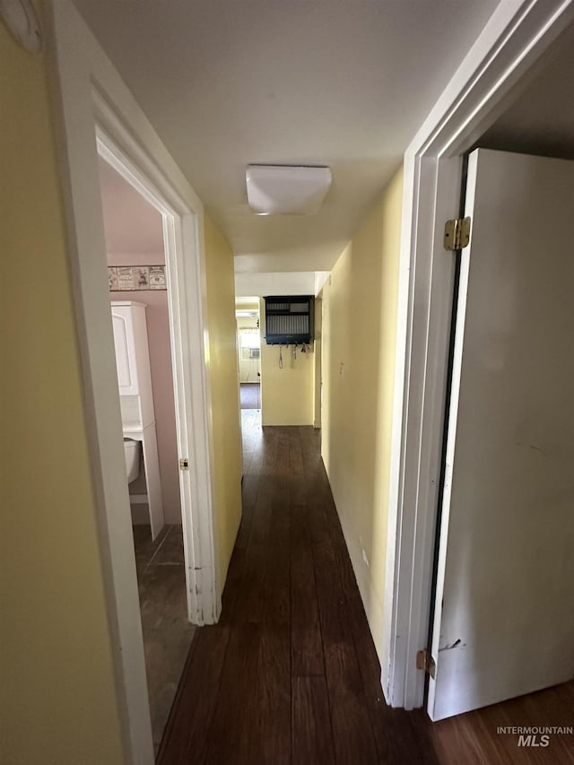 hallway with wood-type flooring