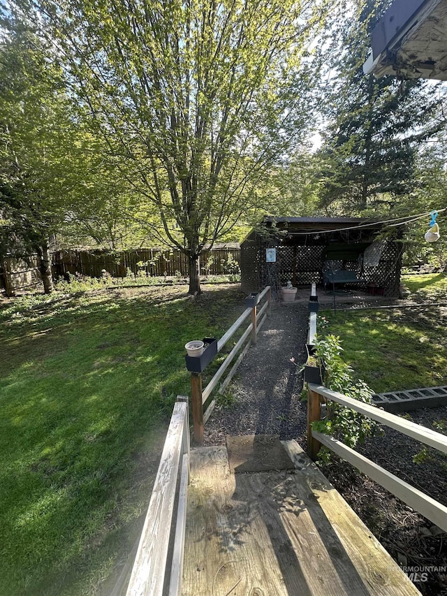 exterior space featuring a yard and fence