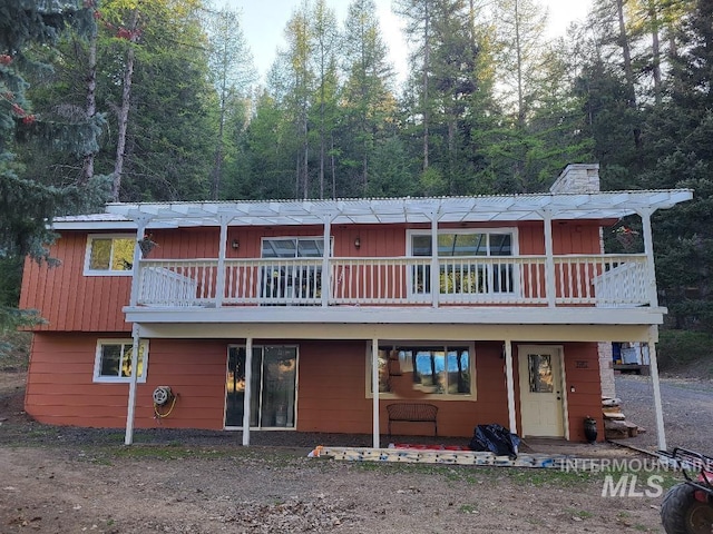 39992 Waha Glen Rd, Lewiston, ID 83501 - rear view of property with a chimney and a balcony