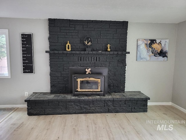 39992 Waha Glen Rd, Lewiston, ID 83501 - details with wood finished floors, baseboards, and a fireplace