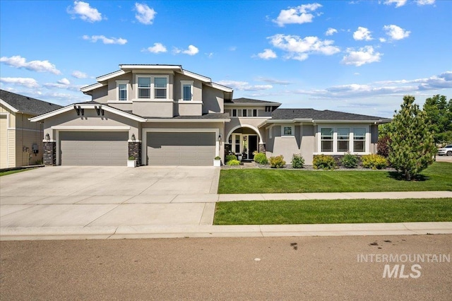 2357 N Synergy Pl, Eagle, ID 83616 - view of front of property featuring stucco siding, a front lawn, concrete driveway, and an attached garage
