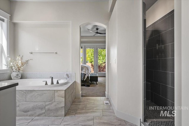 2357 N Synergy Pl, Eagle, ID 83616 - bathroom featuring a bath, a ceiling fan, ensuite bathroom, and baseboards