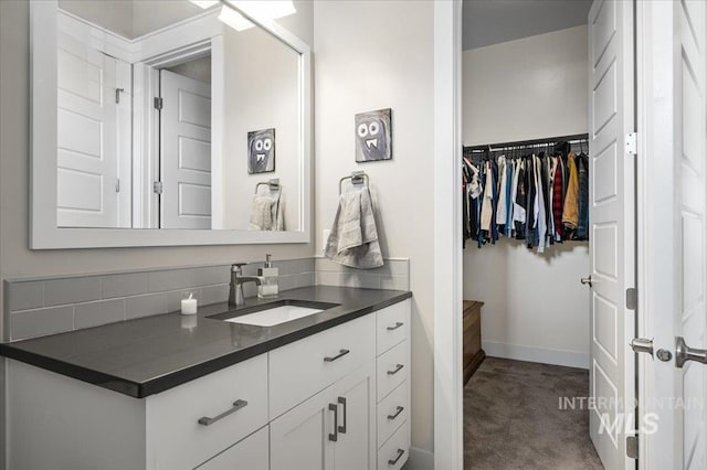 2357 N Synergy Pl, Eagle, ID 83616 - bathroom with vanity, baseboards, and a spacious closet