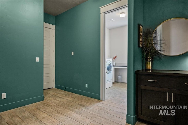 2357 N Synergy Pl, Eagle, ID 83616 - corridor with light wood-style flooring, baseboards, and washer / dryer