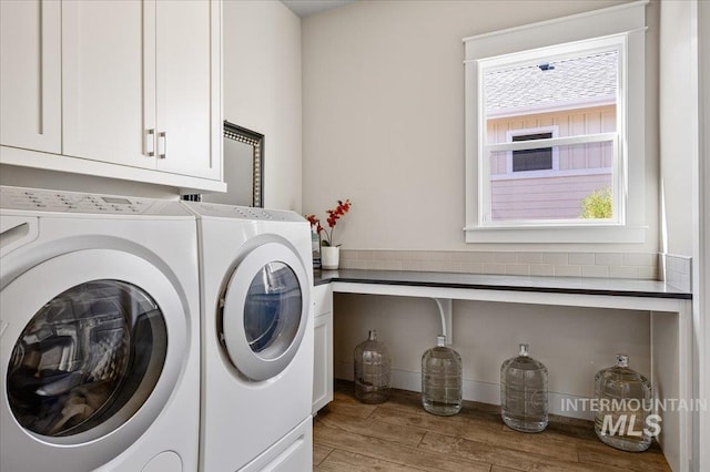 2357 N Synergy Pl, Eagle, ID 83616 - laundry room featuring cabinet space, washer and clothes dryer, and light wood-style flooring