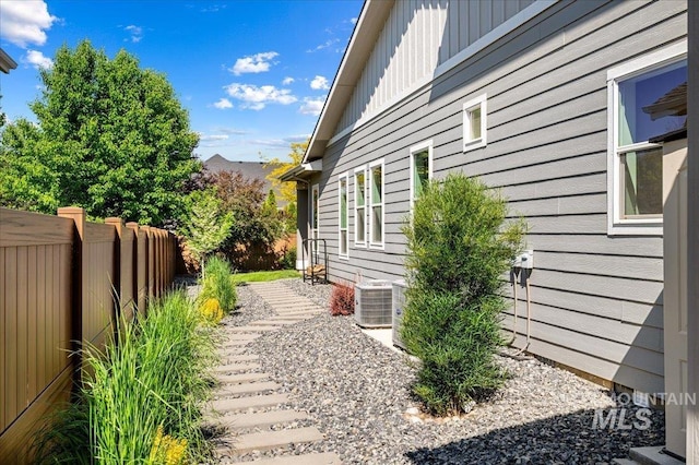 2357 N Synergy Pl, Eagle, ID 83616 - view of side of property with board and batten siding and central AC unit