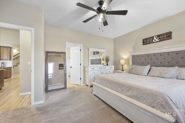 bedroom featuring ceiling fan and light colored carpet