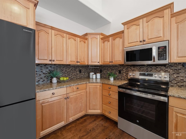 1415 E Lake Crk, Meridian, ID 83642 - kitchen with stainless steel appliances, light brown cabinets, backsplash, light stone countertops, and dark wood-type flooring