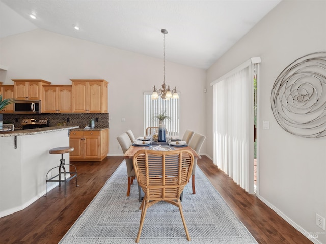 1415 E Lake Crk, Meridian, ID 83642 - dining room featuring vaulted ceiling, dark wood-style flooring, a chandelier, baseboards, and recessed lighting