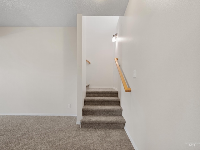 1415 E Lake Crk, Meridian, ID 83642 - stairway with carpet floors, baseboards, and a textured ceiling