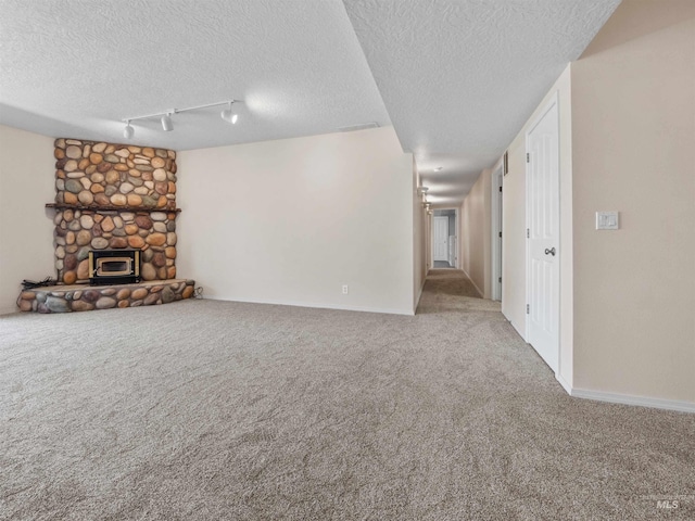1415 E Lake Crk, Meridian, ID 83642 - unfurnished living room featuring carpet, a textured ceiling, and baseboards
