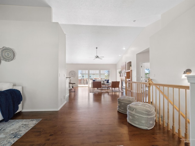 1415 E Lake Crk, Meridian, ID 83642 - sitting room with a ceiling fan, wood finished floors, high vaulted ceiling, an upstairs landing, and baseboards