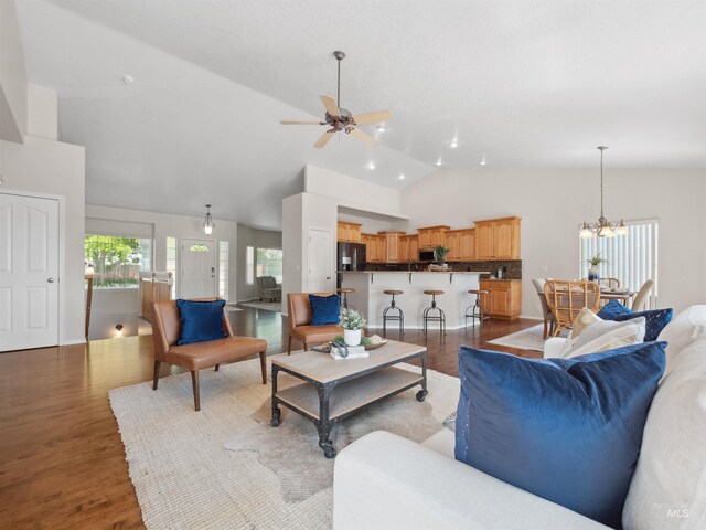 1415 E Lake Crk, Meridian, ID 83642 - living area with a ceiling fan, wood finished floors, a chandelier, and high vaulted ceiling