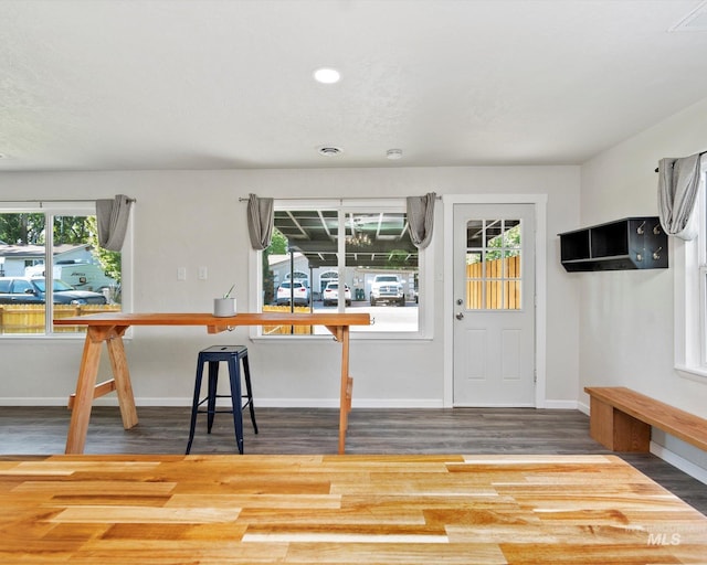 504 E 7th St, Emmett, ID 83617 - unfurnished dining area with wood finished floors, baseboards, and recessed lighting