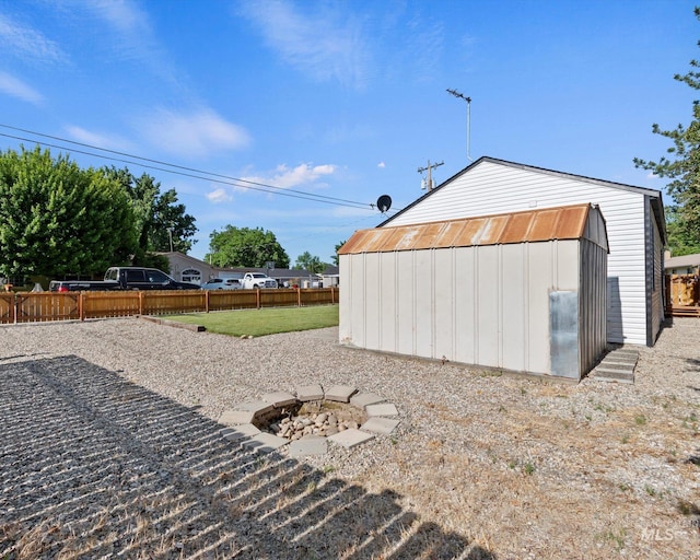 504 E 7th St, Emmett, ID 83617 - view of shed featuring a fenced backyard and an outdoor fire pit