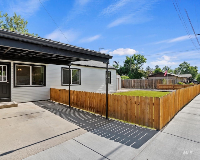 504 E 7th St, Emmett, ID 83617 - view of home's exterior featuring a fenced backyard and a patio