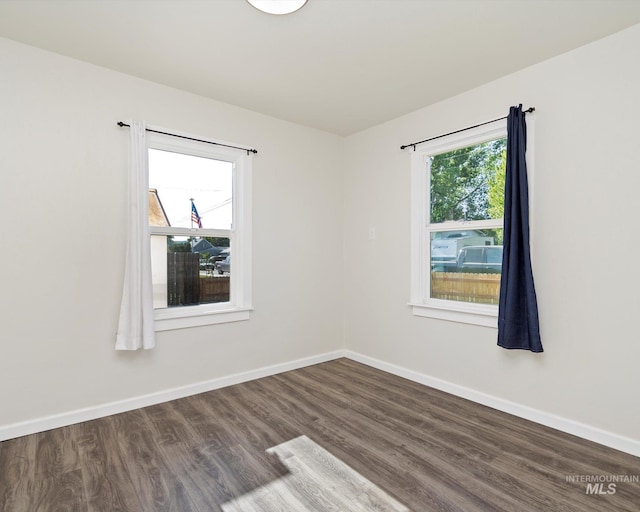 504 E 7th St, Emmett, ID 83617 - empty room featuring wood finished floors and baseboards