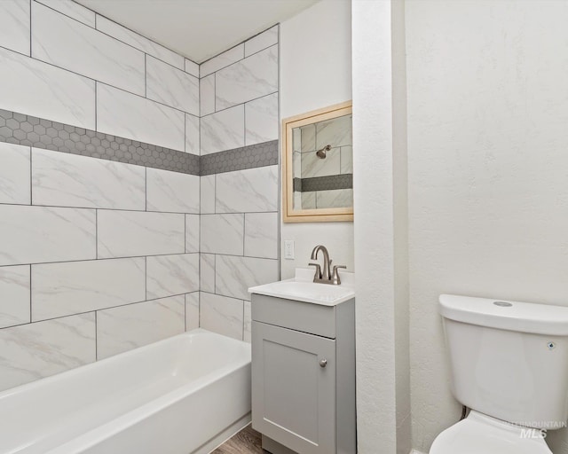 504 E 7th St, Emmett, ID 83617 - bathroom featuring vanity, bathing tub / shower combination, and toilet