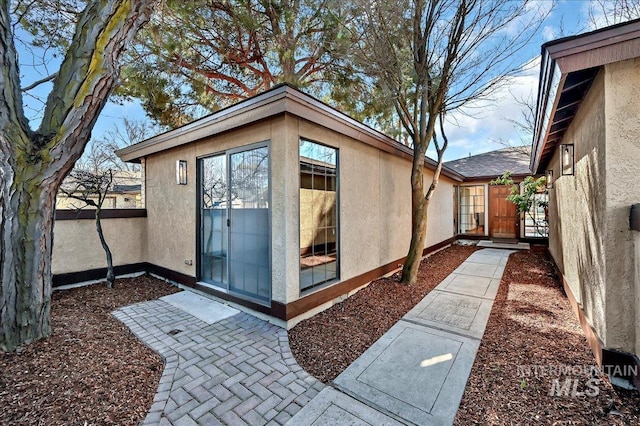 view of outbuilding featuring fence