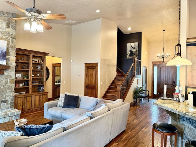 20 Shore Crest Ct, Donnelly, ID 83615 - living area with a ceiling fan, stairs, dark wood-type flooring, a high ceiling, and a textured ceiling