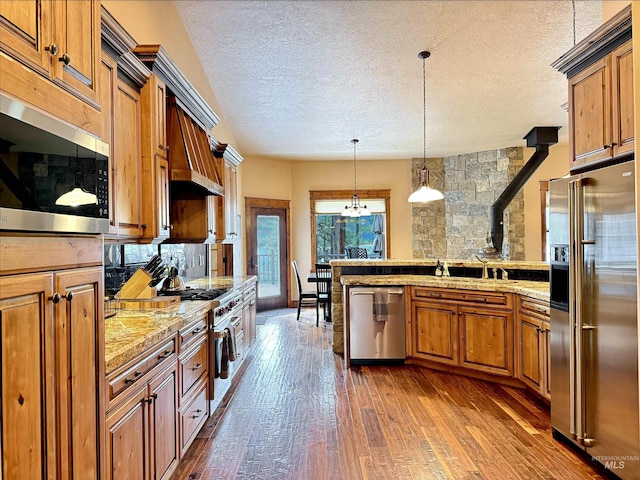 20 Shore Crest Ct, Donnelly, ID 83615 - kitchen with high quality appliances, brown cabinetry, dark wood-style flooring, light countertops, and a wood stove