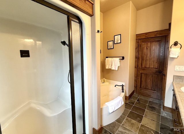 20 Shore Crest Ct, Donnelly, ID 83615 - full bathroom featuring vanity, a stall shower, a bath, tile patterned floors, and baseboards