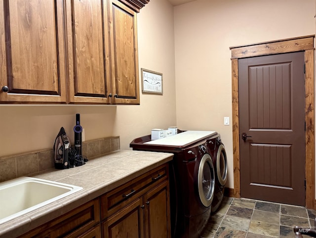 20 Shore Crest Ct, Donnelly, ID 83615 - laundry room with cabinet space, washing machine and clothes dryer, and dark stone finish flooring