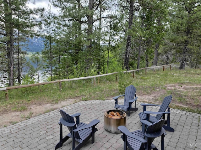 20 Shore Crest Ct, Donnelly, ID 83615 - view of patio featuring an outdoor fire pit and a water view