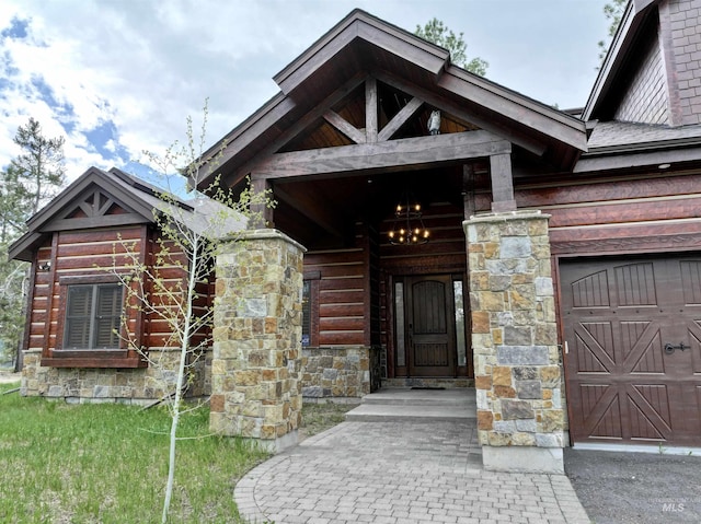 20 Shore Crest Ct, Donnelly, ID 83615 - view of exterior entry featuring stone siding and an attached garage